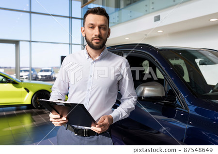 manager of a premium car dealership offers to buy an SUV on credit manager of a premium car dealership offers to buy an SUV on credit 87548649