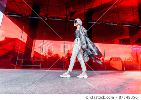 Fashion of the future. Futuristic blonde in red space. Fashion of the future. Futuristic blonde in red space. 87549350