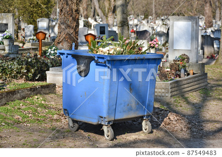 Wheeled garbage can in the public cemetery 87549483