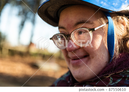 Outdoor portrait of a 39 year old white woman with the Down Syndrome Outdoor portrait of a 39 year old white woman with the Down Syndrome 87550610