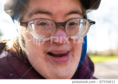 Outdoor portrait of a 39 year old white woman with the Down Syndrome Outdoor portrait of a 39 year old white woman with the Down Syndrome 87550611