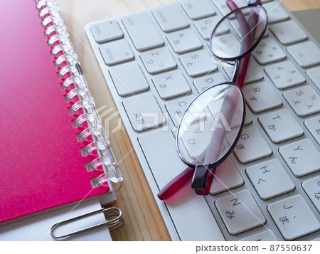 Business image of documents, personal computers, notebooks, glasses (female) Business image of documents, personal computers, notebooks, glasses (female) 87550637