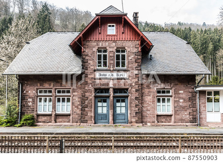 Auw An der Kyll, Rhineland-Palatinate - Germany - Facade in traditional cottage style of the railwaystation of the small typical German village 87550903