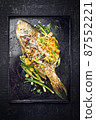 BBQ parrotfish with mango salsa as top view 87552221