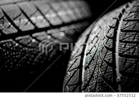 Clean car tires against dark background closeup 87552512