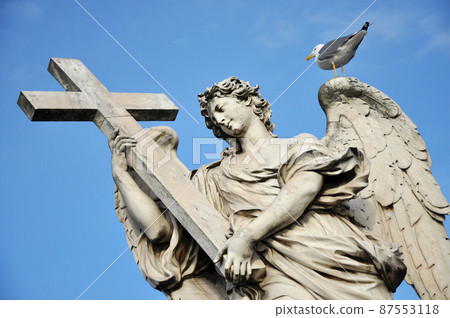 Angel with the Cross. Statue on the Ponte Sant' Angelo bridge, Rome Angel with the Cross. Statue on the Ponte Sant' Angelo bridge, Rome 87553118