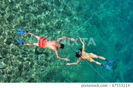 Couple snorkeling at Phi Phi Island, Phuket, Thailand 87553214