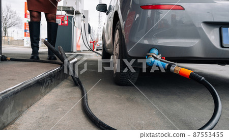 Fuel car. Pump petrol from nozzle in vehicle tank. Gasoline, oil gas station. Economy business with diesel transport. Automotive transportation concept. 87553455
