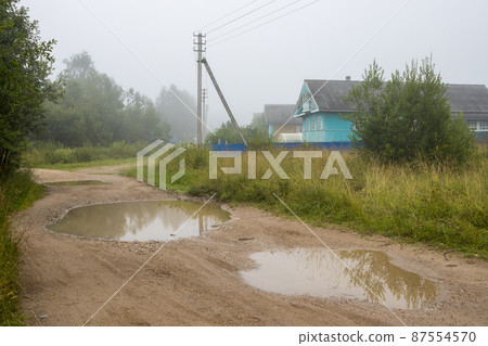 View of the village street and wooden houses View of the village street and wooden houses 87554570