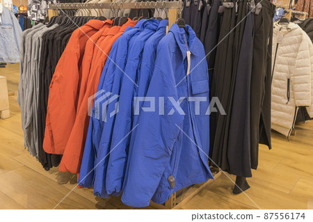 men's winter jackets on hangers in the store men's winter jackets on hangers in the store 87556174