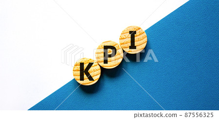 KPI, key performance indicator symbol. Concept word KPI, key performance indicator on wooden circles on beautiful white background, copy space. Business, KPI, key performance indicator concept. KPI, key performance indicator symbol. Concept word KPI, key performance indicator on wooden circles on beautiful white background, copy space. Business, KPI, key performance indicator concept. 87556325