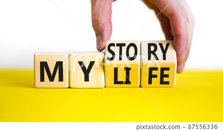Story of my life symbol. Businessman turns wooden cubes and changes concept words My story to My life. Beautiful yellow table white background. Business story of my life concept. Copy space. Story of my life symbol. Businessman turns wooden cubes and changes concept words My story to My life. Beautiful yellow table white background. Business story of my life concept. Copy space. 87556336