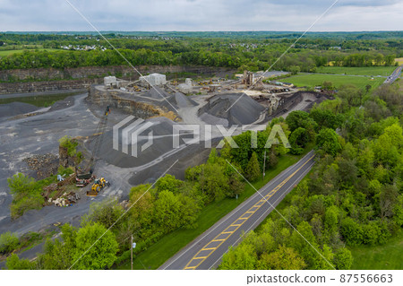 Top view, panorama of heavy opencast mining quarry machinery works in a stone quarry 87556663