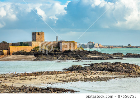 Saint Aubin Fort in a low tide waters with Elizabeth castle, bailiwick of Jersey, Channel Islands 87556753