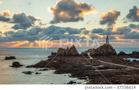 Road to La Corbiere lighthouse with cliff and sunset,  bailiwick of Jersey, Channel Islands 87556814