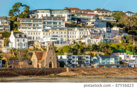 Saint Aubin town seashore view with Sacred heart of Jesus church, Channel Islands 87556823
