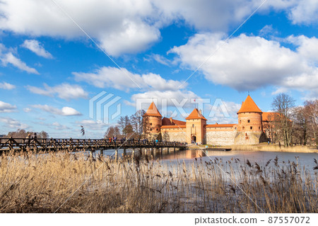 Trakai Island Castle orange walls and towers, lake Galve, Republic of Lithuania Trakai Island Castle orange walls and towers, lake Galve, Republic of Lithuania 87557072