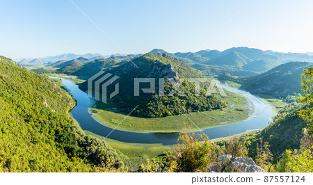 Pavlova strana viewpoint to the river bent and mountains, skadar lake national park, Montenegro Pavlova strana viewpoint to the river bent and mountains, skadar lake national park, Montenegro 87557124