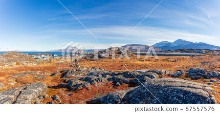 Autumn greenlandic  tundra, Inuit settlement and Sermitsiaq mountain, Nuuk, Greenland 87557576