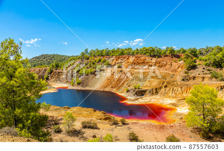 Red colored hazardous polluted Sha mine lake, Nicosia, Cyprus 87557603