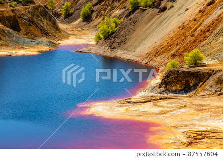 Heavy polluted bloody colored Sha copper mine lake, Nicosia, Cyprus 87557604