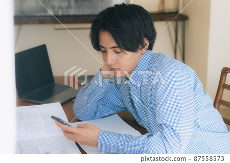 Young man tired of studying Young man tired of studying 87558573