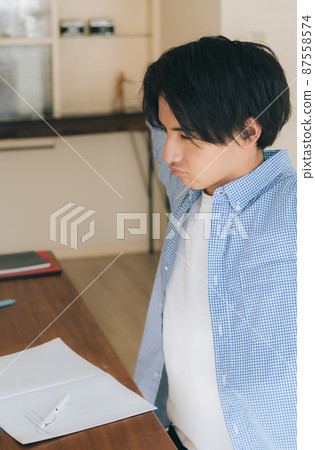 Young man tired of studying Young man tired of studying 87558574