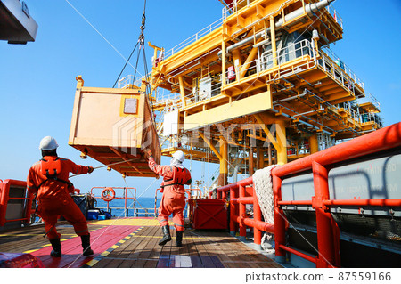 Crews boat moving the passenger and cargo from the platform to supply boat in oil and gas industry. Support offshore oil and gas industry by boat and service team. Crews boat moving the passenger and cargo from the platform to supply boat in oil and gas industry. Support offshore oil and gas industry by boat and service team. 87559166