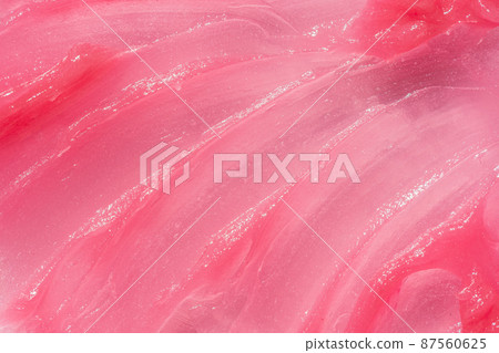 Pink creamy balm product closeup. Moisturising and cleaning beauty product sample swatch. Cosmetic smear texture 87560625