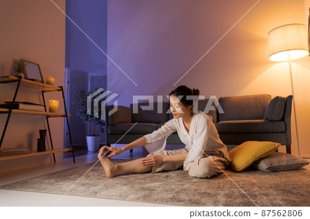 Woman massaging at home Woman massaging at home 87562806
