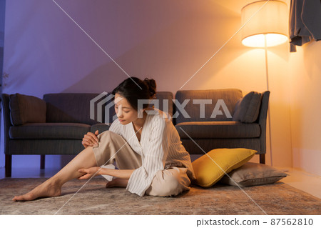 Woman massaging at home Woman massaging at home 87562810