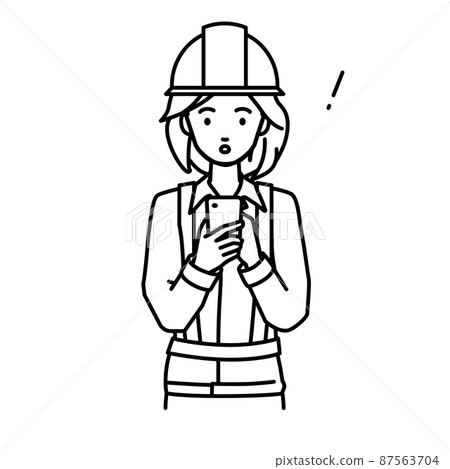 A woman at a construction site who was surprised to notice something while standing and operating a smartphone A woman at a construction site who was surprised to notice something while standing and operating a smartphone 87563704