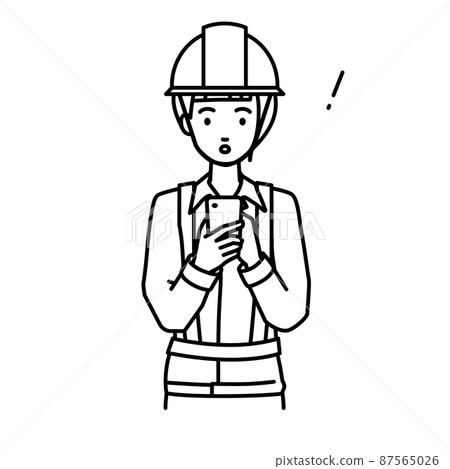 A woman at a construction site who was surprised to notice something while standing and operating a smartphone A woman at a construction site who was surprised to notice something while standing and operating a smartphone 87565026