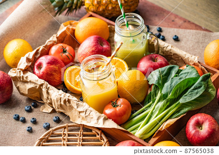 A collection of vegetable smoothies, fruit smoothies, vegetables and fruits 87565038