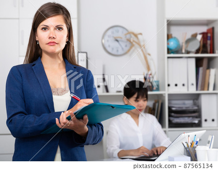 Businesswoman welcoming to office 87565134