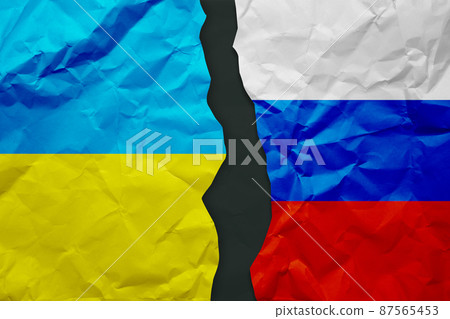 Ukraine and Russia flags painted on paper wall background, political partnership conflicts concept Ukraine and Russia flags painted on paper wall background, political partnership conflicts concept 87565453