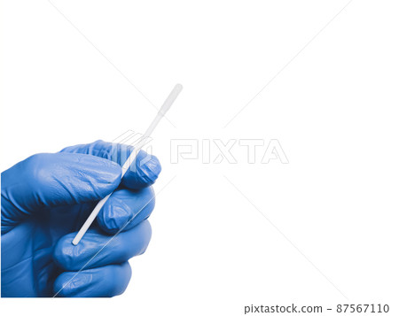 Cotton swab in a medical hand isolated on white background with copy space,Coronavirus concept 87567110