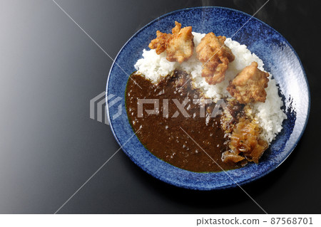 A bird's-eye view of hot fried curry with Fukujinzuke on a black background A bird's-eye view of hot fried curry with Fukujinzuke on a black background 87568701