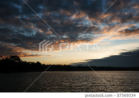 Tranquil landscape of lake inside tropical rainforest at sunrise. 87569334