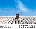 Shisa symbol of Okinawa Lion on original Ryukyu architecture roof art Okinawa island Japan 87572122