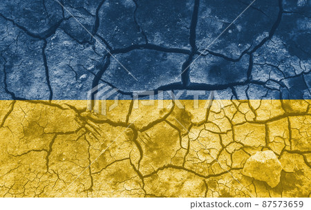 Ukrainian national flag pattern cracked earth, war concept Ukrainian national flag pattern cracked earth, war concept 87573659