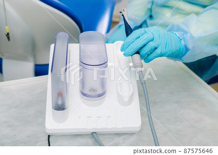 Ultrasonic scaler in the dental office. Dentistry Concept Ultrasonic scaler in the dental office. Dentistry Concept 87575646