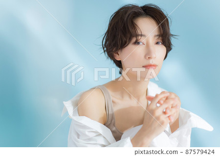 A woman with short hair A woman with short hair 87579424