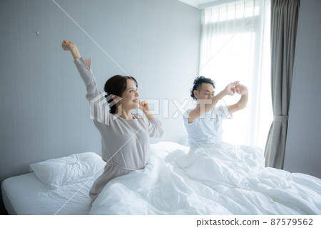 Bedroom couple wake up Bedroom couple wake up 87579562