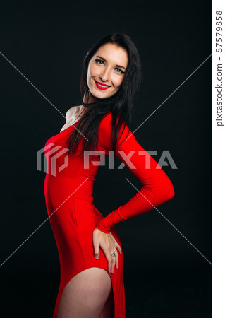 Sexy and beautiful girl in glamour red dress. 87579858