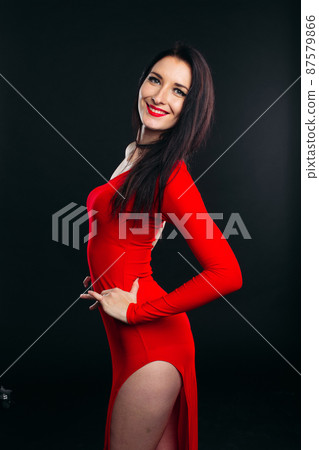 Sexy and beautiful girl in glamour red dress. Sexy and beautiful girl in glamour red dress. 87579866