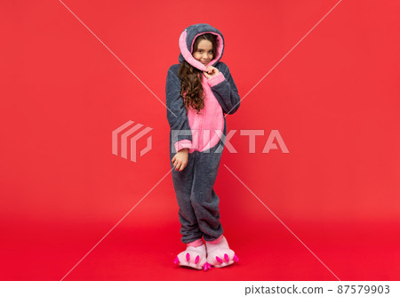 shy smiling child in cozy sleepwear. sweet dreams. comfortable pajama or home bathrobe. shy smiling child in cozy sleepwear. sweet dreams. comfortable pajama or home bathrobe. 87579903