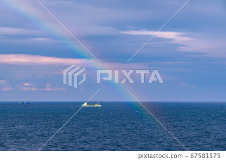 Rainbow over the sea 87581575