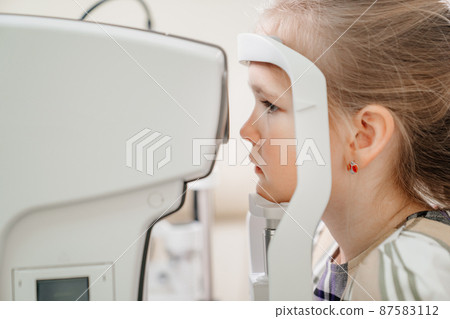 examination of the girl on the corneo topographer.modern clinic examination of the girl on the corneo topographer.modern clinic 87583112