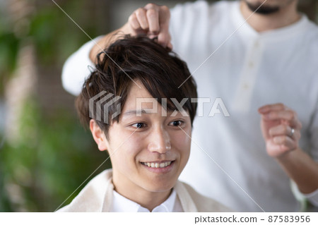 A man set by a stylist A man set by a stylist 87583956